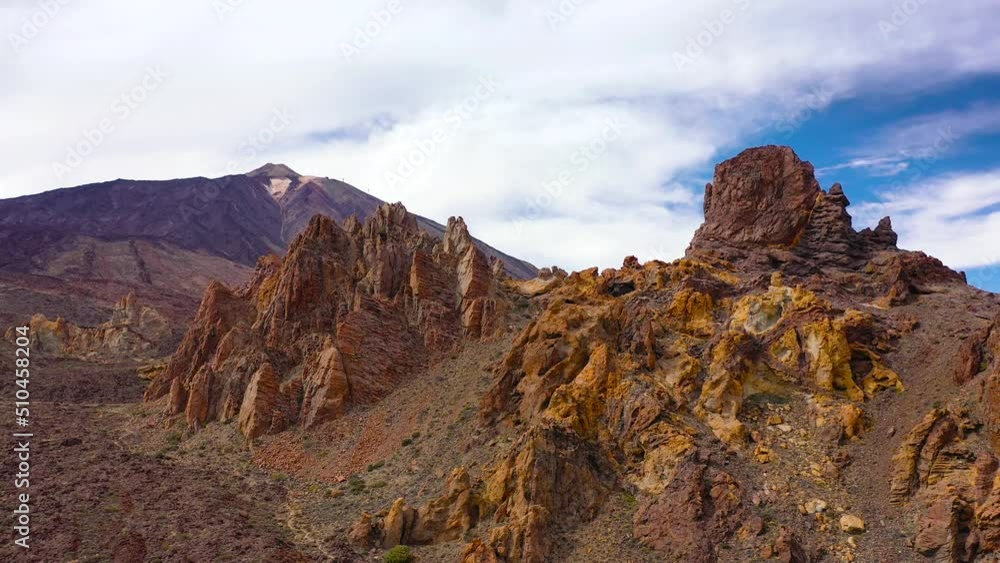 Aerial view of the Teide National Park, flight over a desert rocky surface, view on the Teide volcano. Tenerife, Canary Islands Aerial view of the Teide National Park, flight over a desert rocky surface, view on the Teide volcano. Tenerife, Canary Islands