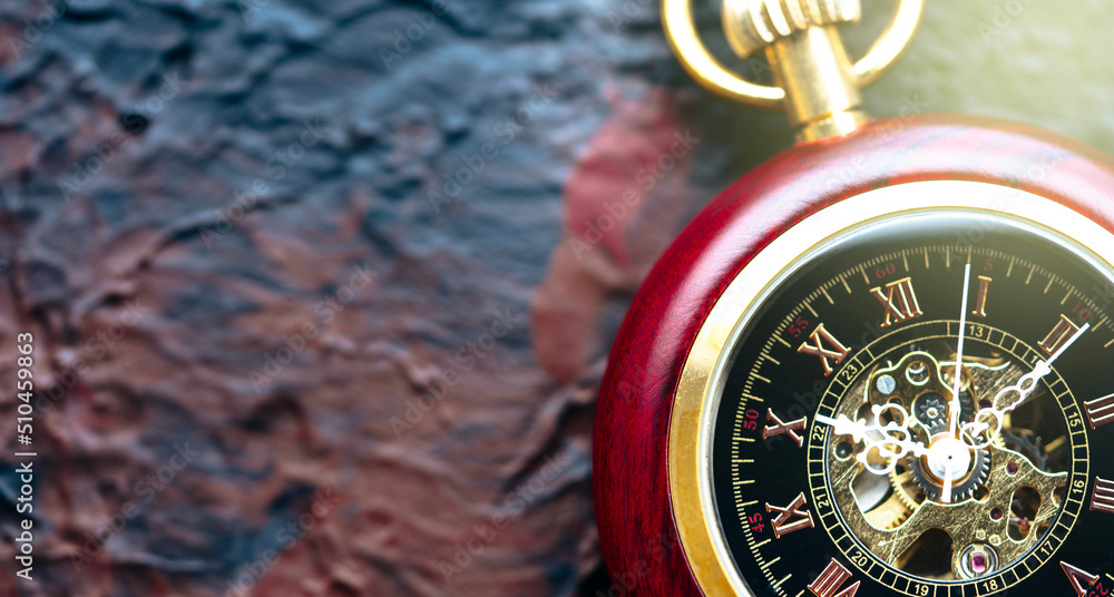 Fototapeta premium Pocket watch on the black background 