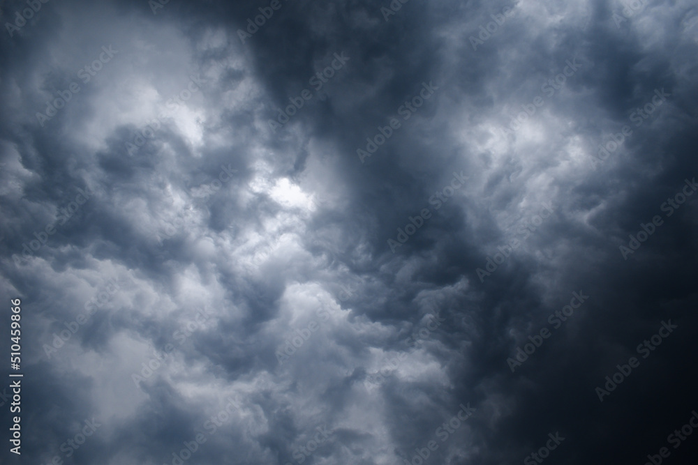 Dark thunderstorm clouds and clouds shining due to light grey color horizontal image Dark thunderstorm clouds and clouds shining due to light grey color horizontal image