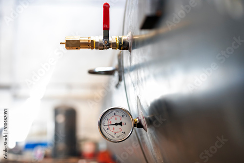 View of hydrostatic test of pressure cylindrical tank or pressure vessel and safety valve (check valve) and manometer. photo