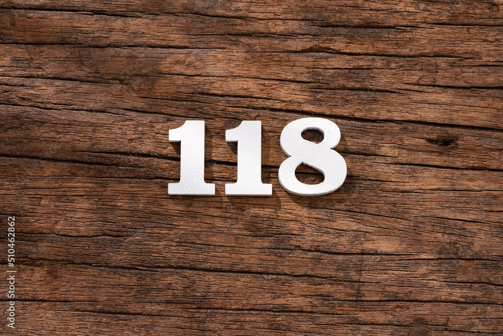 Number 118 - piece on rustic wood background Number 118 - piece on rustic wood background