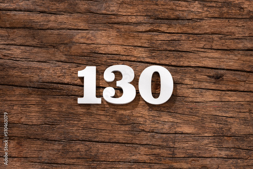 Number 130 - piece on rustic wood background