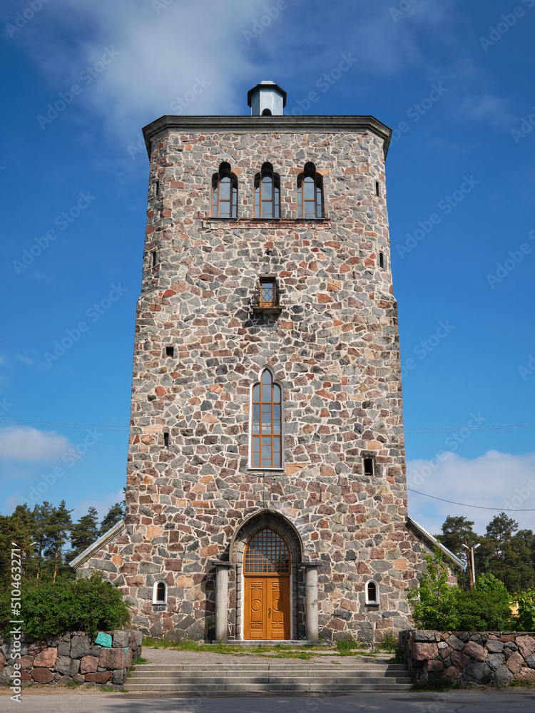 Finnish Lutheran church Kakisalmi in Priozersk against blue sky on a summer sunny day. Finnish Lutheran church Kakisalmi in Priozersk against blue sky on a summer sunny day.