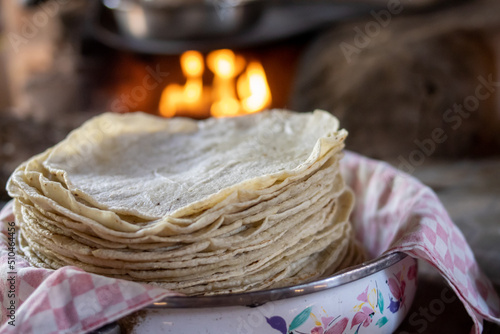 preparacion de nixtamal de maiz, para la elaboracion de tortillas torteadas en cocinas tradicionales mexicanas, en san gregorio, mixtlan, jalisco photo