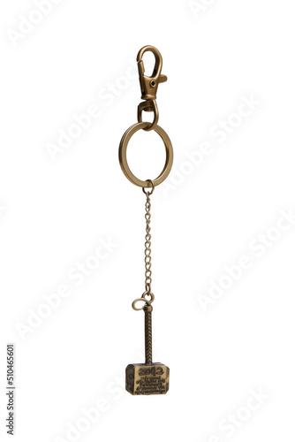 Close-up shot of a bronze hammer keychain with an inscription. The key ring Hammer is isolated on a white background. Front view. © Redumbrella