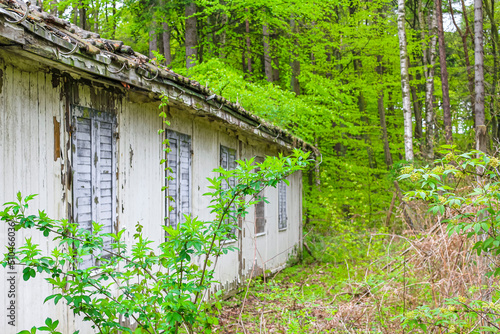 Broken destroyed old house in forest Germany. photo