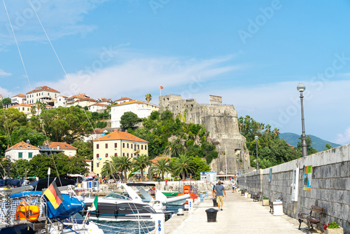 Fotografering View of city Herceg Novi and fortress from pier