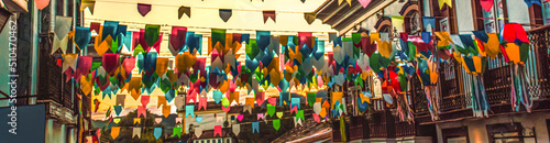 Fotografia Brazilian june party (festas juninas) street decoration, with colorful flags and
