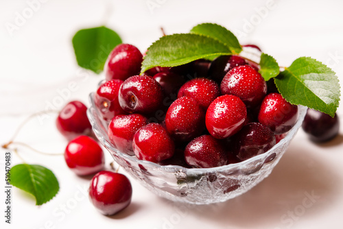 Cherry background. Sweet cherries in a glass plate close up. photo