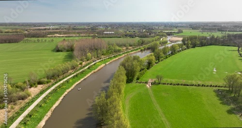 Aerial view, turning around, of river Linge and lake Grote Wiel with road, Betuwe, Gelderland, Netherlands photo