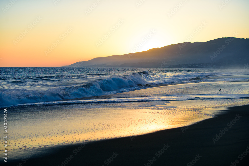 Panoramic sea ocean sunrise. Sunset with large yellow sun under the sea surface. Waves splashes. Ocean waves background.