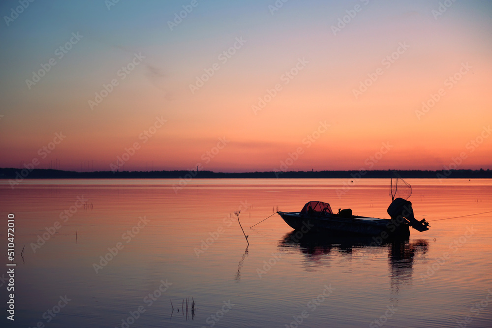The fishing boat with equipment is preparing for the sea for night fishing. The concept of sports fishing, tourism and rest. Soft focus, night fishing, copy space