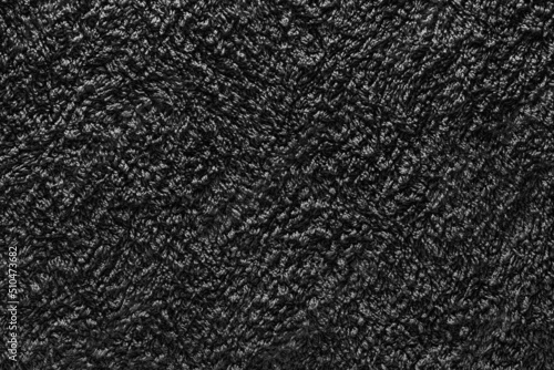 Background of gray coarse fabric texture in the dark