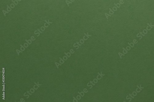 Green paper texture. Blank green paper background in olive tone photo