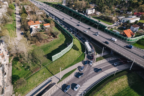 Capital city round about and juncture roads from aerial perspective in urban environment 