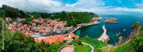 Panoramic view of Cudillero from the viewpoint of La Garita, town, port and lighthouse, Asturias. photo