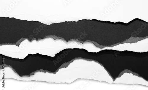 Ripped black and white paper edges background