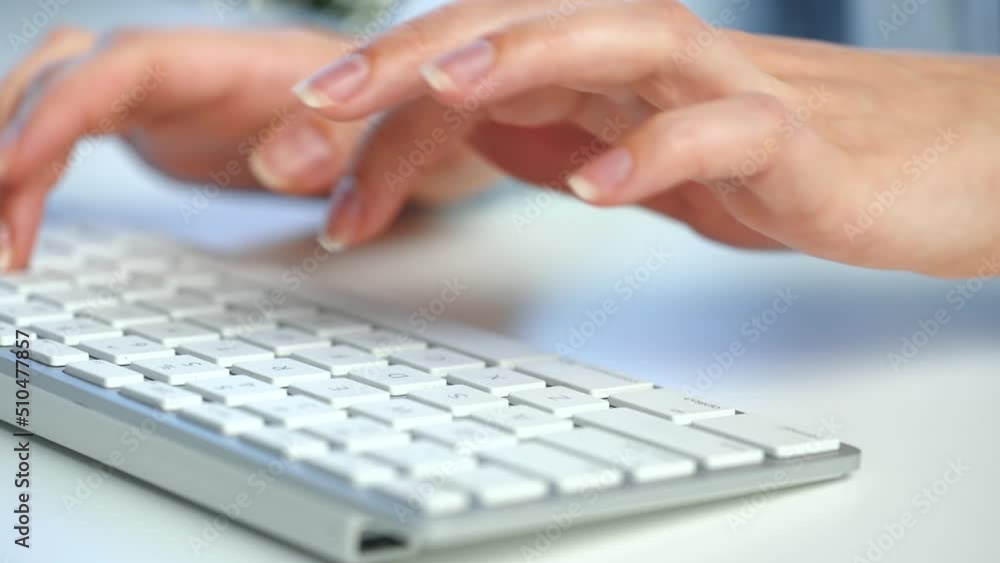 Female hands busy working on computer keyboard for sending emails and surf on a web browser Female hands busy working on computer keyboard for sending emails and surf on a web browser