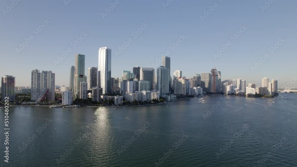 Aerial Beautiful Shot Of Towers Against Clear Sky, Drone Panning Over Sea In City - Miami, Florida Aerial Beautiful Shot Of Towers Against Clear Sky, Drone Panning Over Sea In City - Miami, Florida