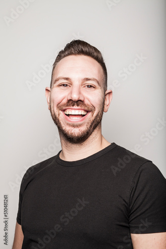 Portrait of young man smiling in studio