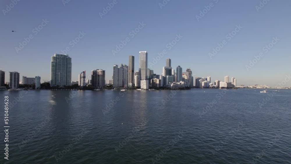 Aerial Shot Of Modern Towers Against Clear Sky In City, Drone Flying Forward Over Sea - Miami, Florida Aerial Shot Of Modern Towers Against Clear Sky In City, Drone Flying Forward Over Sea - Miami, Florida