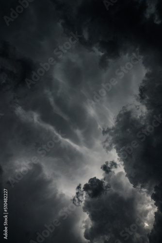 Dark, gloomy, stormy, rainy sky with rays of light. Terrible hurricane clouds. Background image for design © subjob