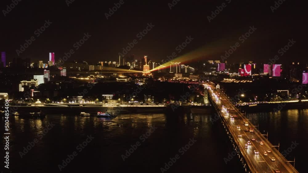Aerial view of Yangtze River bridge at night in Wuhan downtown, China. Aerial view of Yangtze River bridge at night in Wuhan downtown, China.