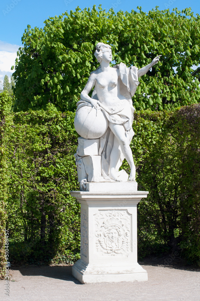 White marble sculptures in the park in front of the Belvedere Palace. Historical and tourist attractions in Viene, Austria White marble sculptures in the park in front of the Belvedere Palace. Historical and tourist attractions in Viene, Austria