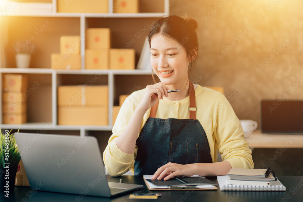 Fototapeta premium Partnership of SME entrepreneur teamwork of small business work at home family online marketing with packing box prepare for deliverty to customers at warehouse home seller office