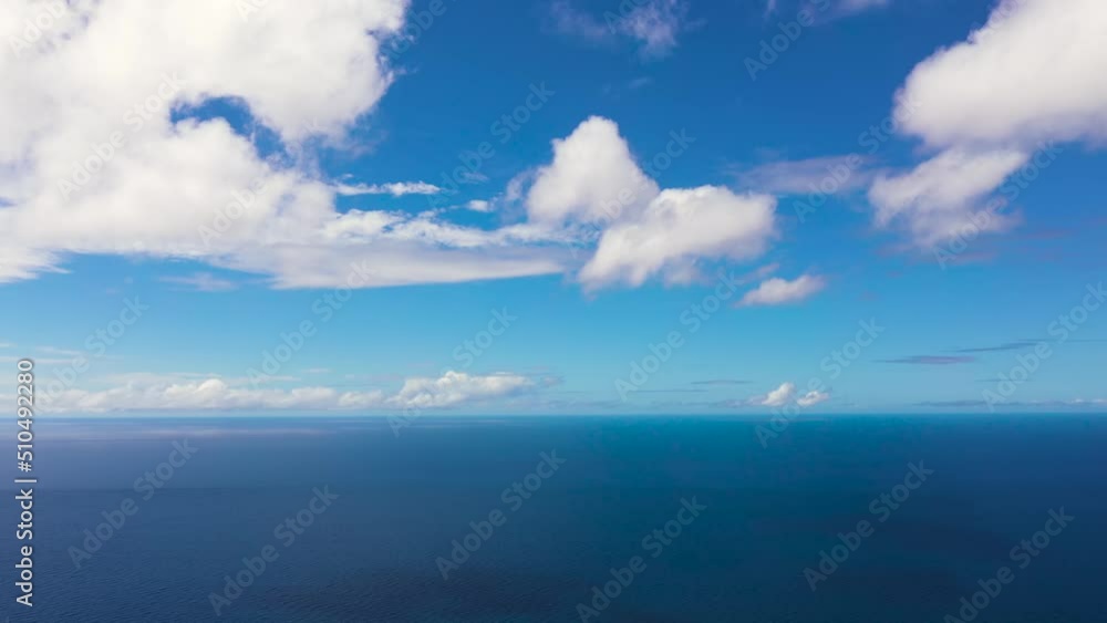 Aerial drone of Blue sea and sky with clouds. Summer and travel vacation concept. Aerial drone of Blue sea and sky with clouds. Summer and travel vacation concept.