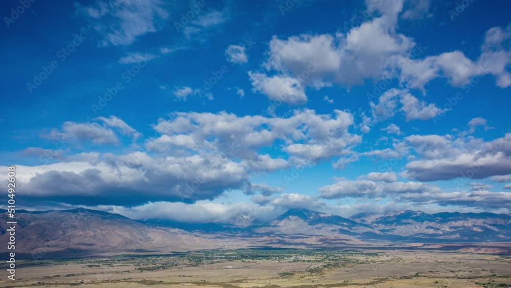 Time Lapse - Beautiful cloudscape moving over mountain range and the valley Time Lapse - Beautiful cloudscape moving over mountain range and the valley