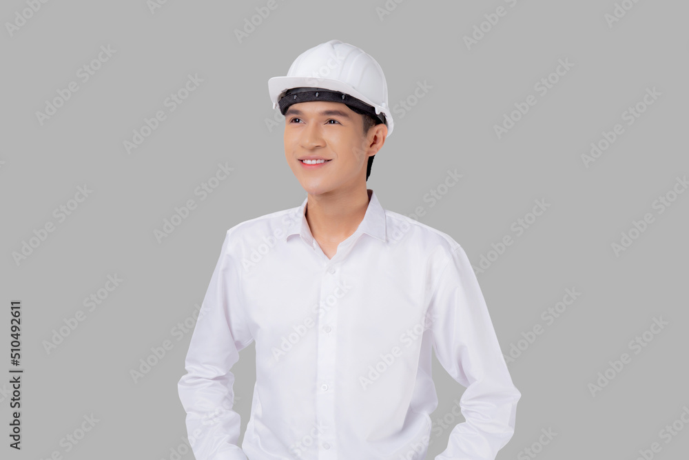 Portrait young asian man is engineer wearing helmet standing and smiling with confident isolated on white background, handsome male is architect or contractor, worker or labor, industrial concept. Portrait young asian man is engineer wearing helmet standing and smiling with confident isolated on white background, handsome male is architect or contractor, worker or labor, industrial concept.