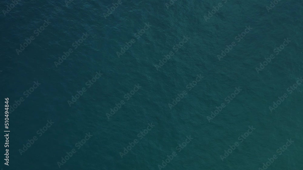 Aerial view top-down of blue water surface Aerial view top-down of blue water surface