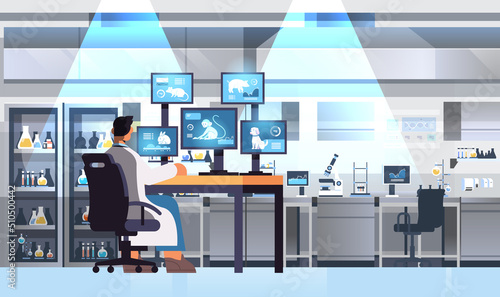 veterinary worker work on desktop with animals on screens scientist doing experiments in lab biological genetic engineering research