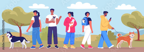 Cute young people walking in the park with their funny pets