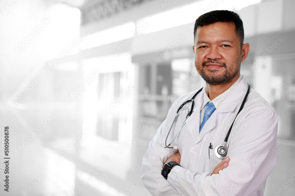 Portrait of handsome man Doctor in hospital background ,smart doctor with stethoscope wear mask at hospital or clinic,Handsome doctor in lab coat using tablet computer in clinic. Portrait of handsome man Doctor in hospital background ,smart doctor with stethoscope wear mask at hospital or clinic,Handsome doctor in lab coat using tablet computer in clinic.