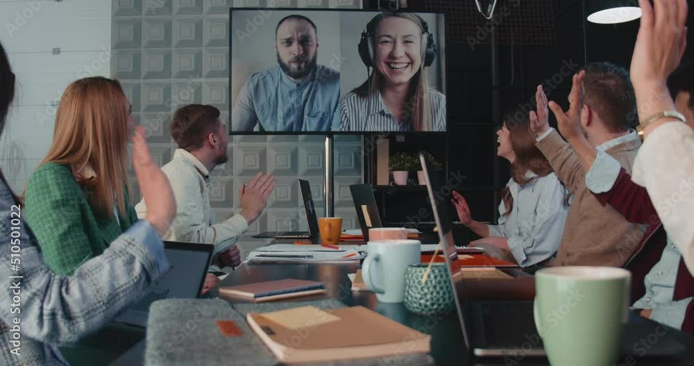 Group of business people use projector for web conference, video call with distant partners at modern office slow motion Group of business people use projector for web conference, video call with distant partners at modern office slow motion