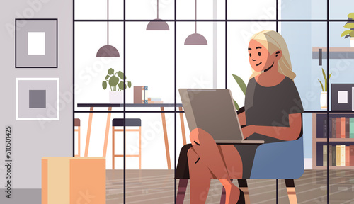 overworked businesswoman freelancer looking at laptop screen business woman using notebook working in office