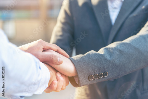 Trust honesty business customer handshake together promise respect partner. Businessman diversity solidarity team multiethnic Partner hands together teamwork. Multiracial meeting shaking hands concept