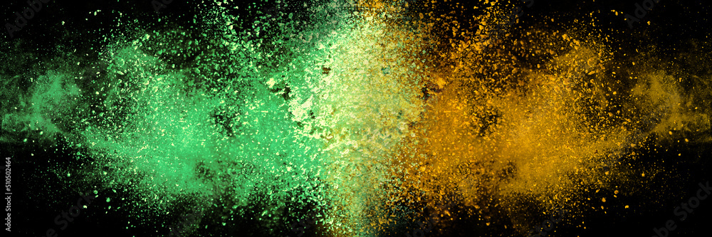Explosion, Splashes of turmeric on a black background. India Seasoning. The orange powder of the turmeric root. Explosion of powder Explosion, Splashes of turmeric on a black background. India Seasoning. The orange powder of the turmeric root. Explosion of powder