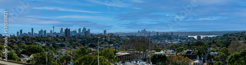 Panorama view of Sydney CBD and Sydney Harbour. Distant view of High-rise office towers and high-rise apartment buildings. Suburban Sydney Suburbs in the foreground NSW Australia   © Elias Bitar
