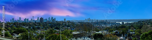 Panorama view of Sydney CBD and Sydney Harbour. Distant view of High-rise office towers and high-rise apartment buildings. Suburban Sydney Suburbs in the foreground NSW Australia   © Elias Bitar