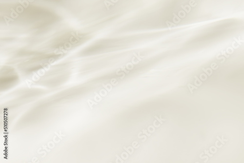 高級感のあるベージュのすべすべとした質感のドレープ背景