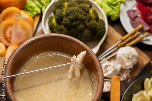 ingredients for bagna cauda sauce with cream and anchovies photo