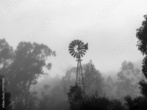 Windmill in the morning fog of outback Australia