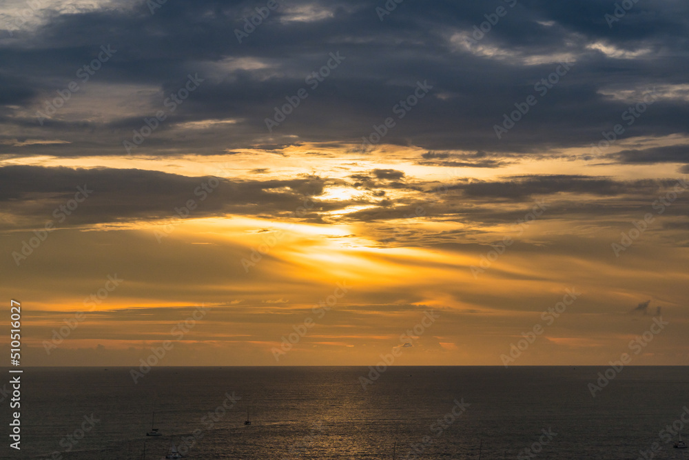 The sun is falling in sunset time at Promthep Cape in Phuket, Thailand. The sun is falling in sunset time at Promthep Cape in Phuket, Thailand.