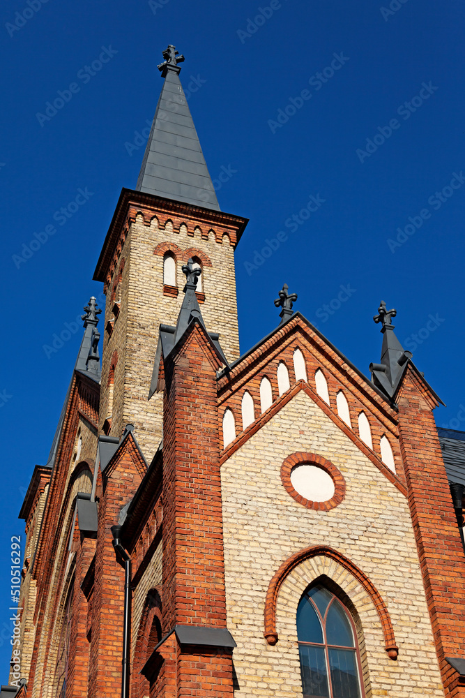 Gavle, Norrland Sweden - July 17, 2021: an old church that feels trapped in the street scene