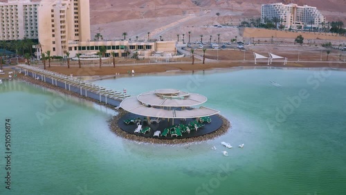 Dead sea hotels and tourists area at sunrise, Israel, 4k aerial drone view