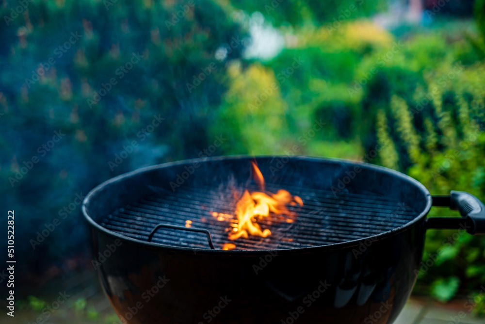 black barbecue with burning coals outside, fire black barbecue with burning coals outside, fire