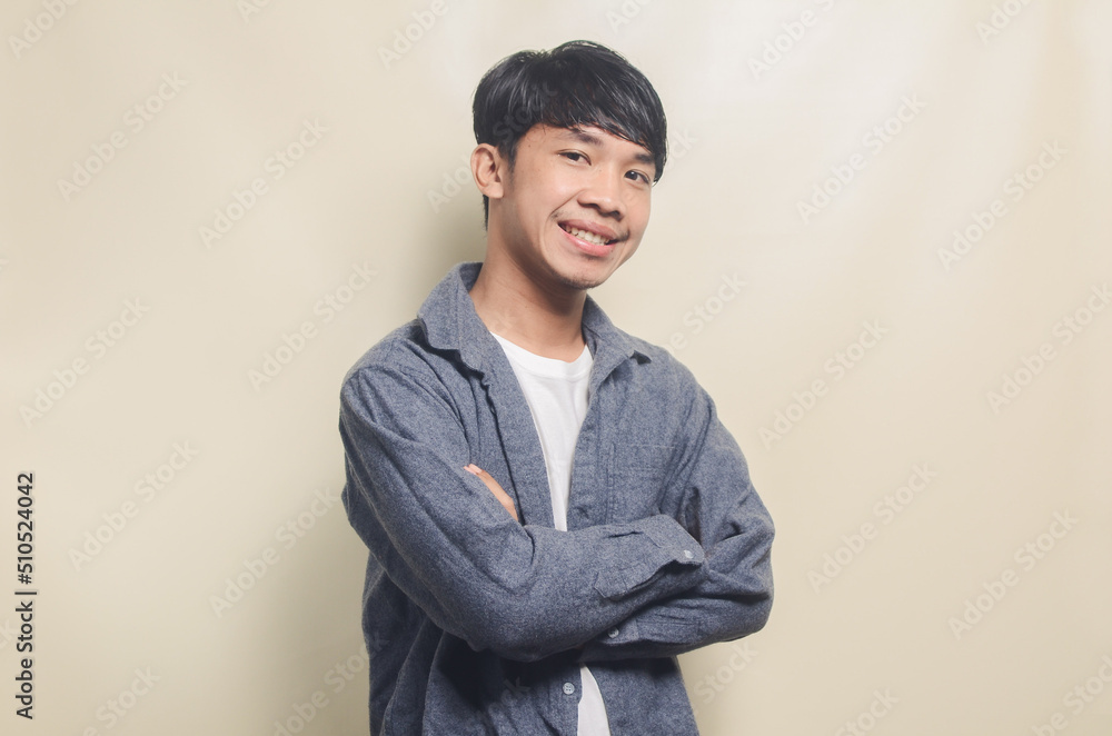 Portrait of handsome man in gray shirt with smiling face Portrait of handsome man in gray shirt with smiling face